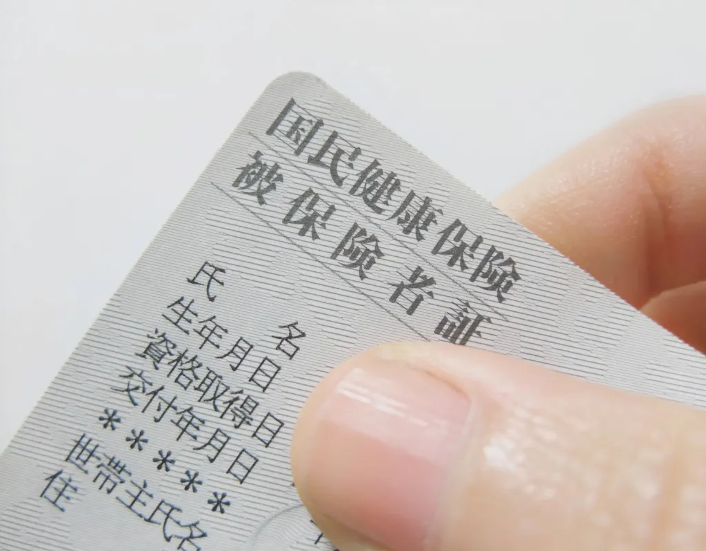Japanese Hospitals; a person holding a Health Insurance card