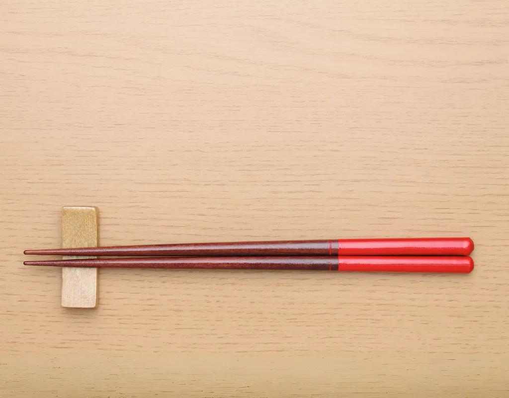 pair of chopsticks on a wooden table