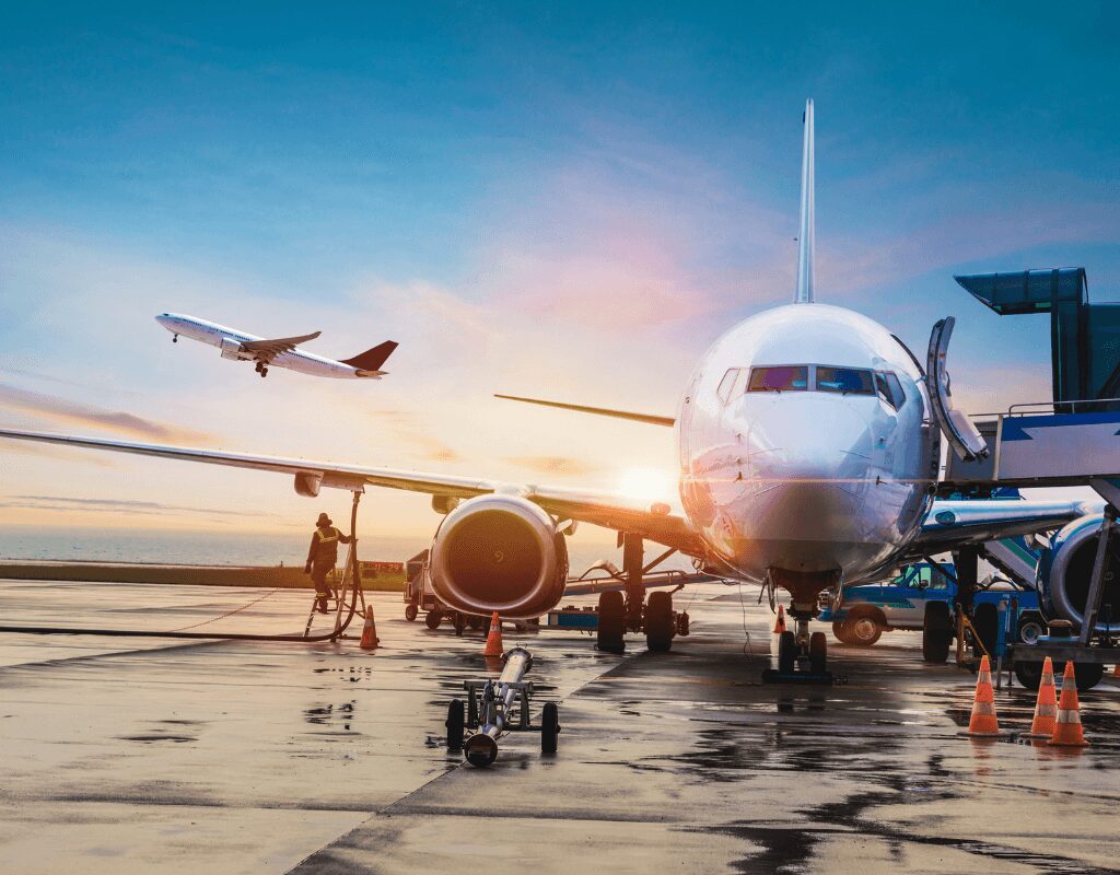 a group of airplanes at an airport