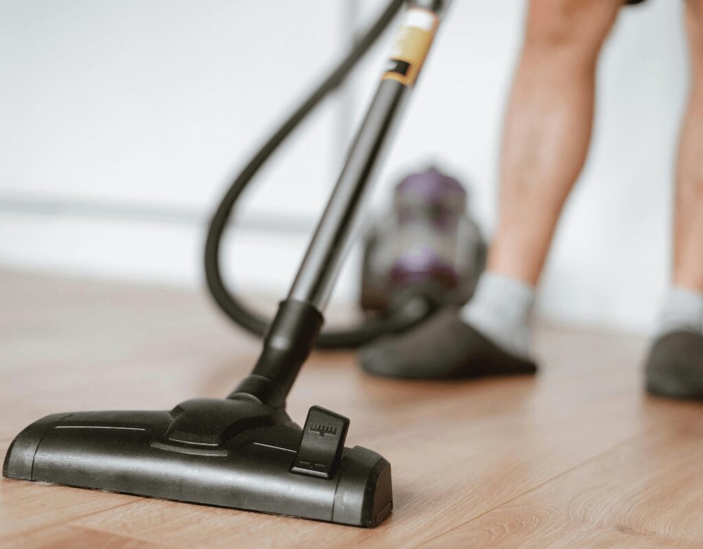 a vacuum cleaner on a wood floor