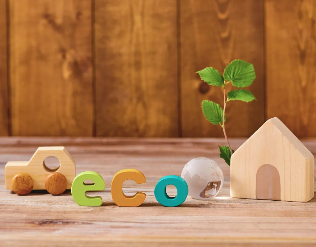 a wooden house and a small car